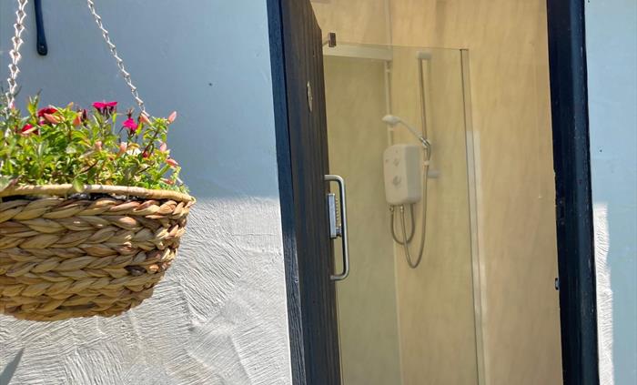 shower with hanging basket outside